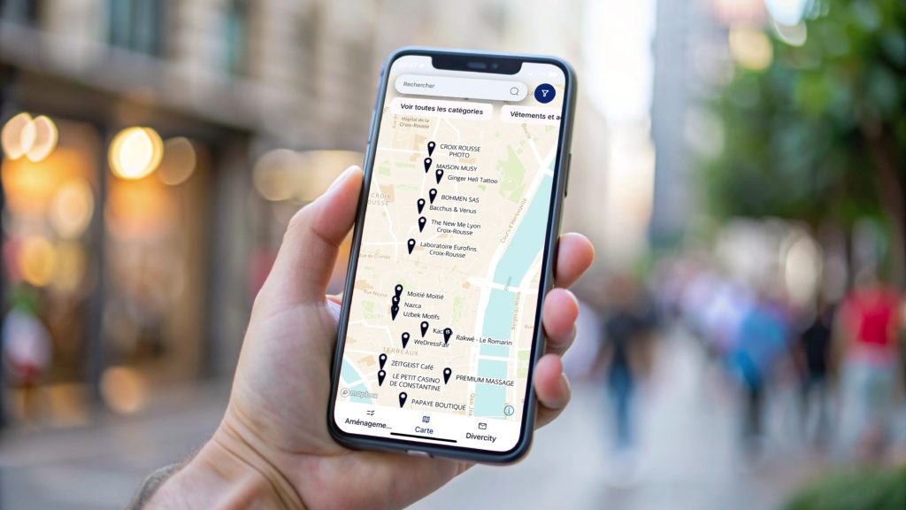 Hand holding smartphone with blank screen in city.
